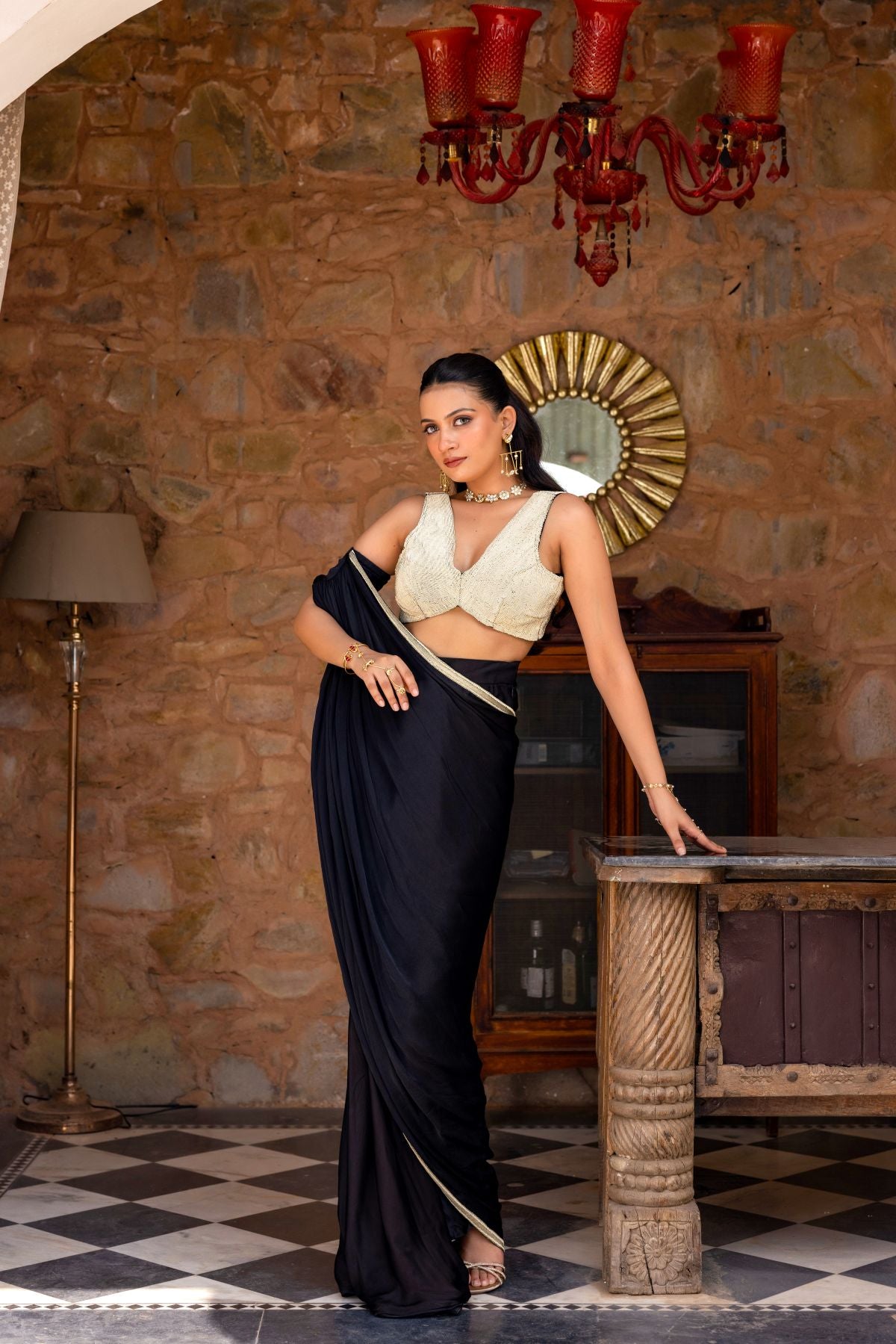 Black draped saree paired with a blouse