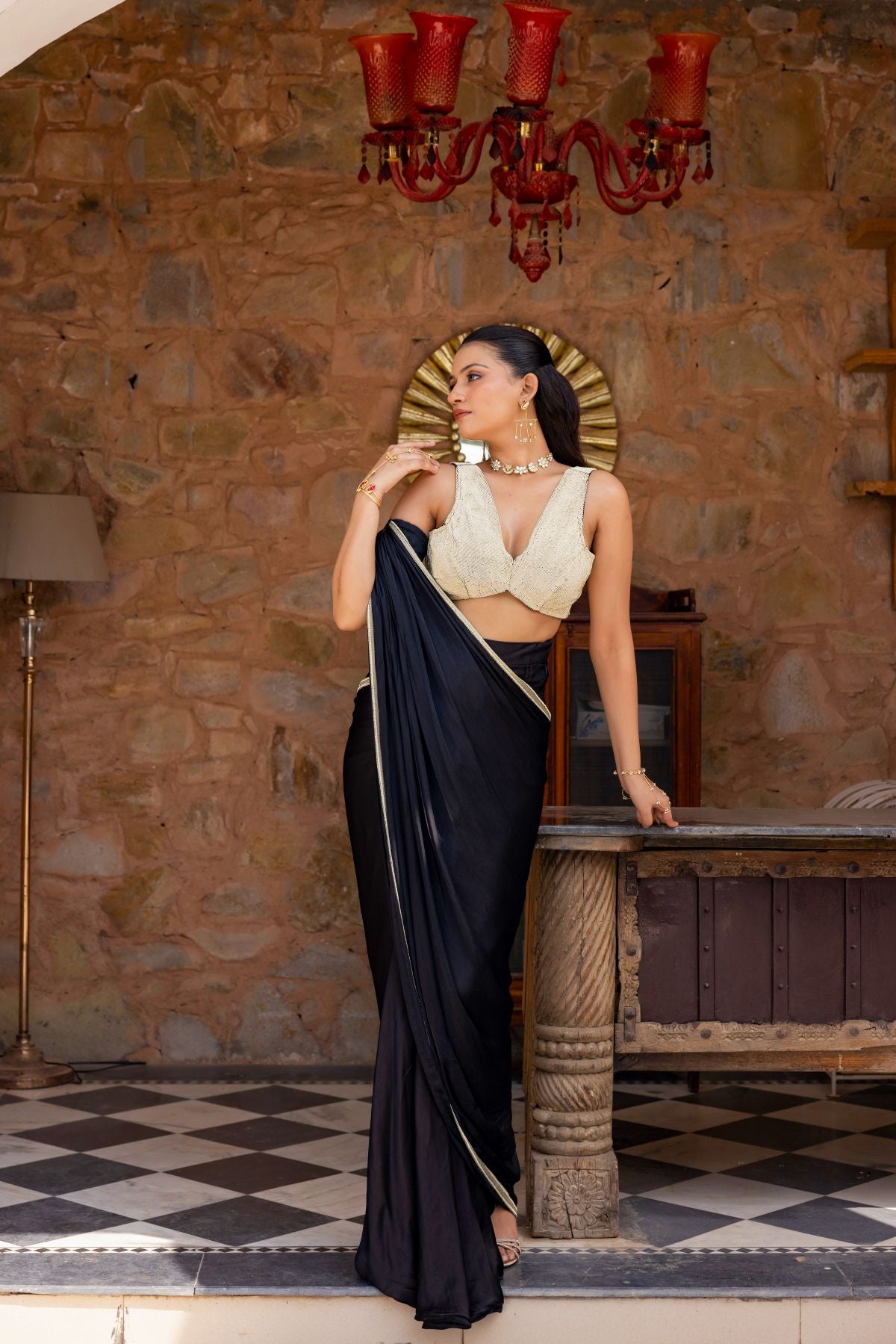 Black draped saree paired with a blouse