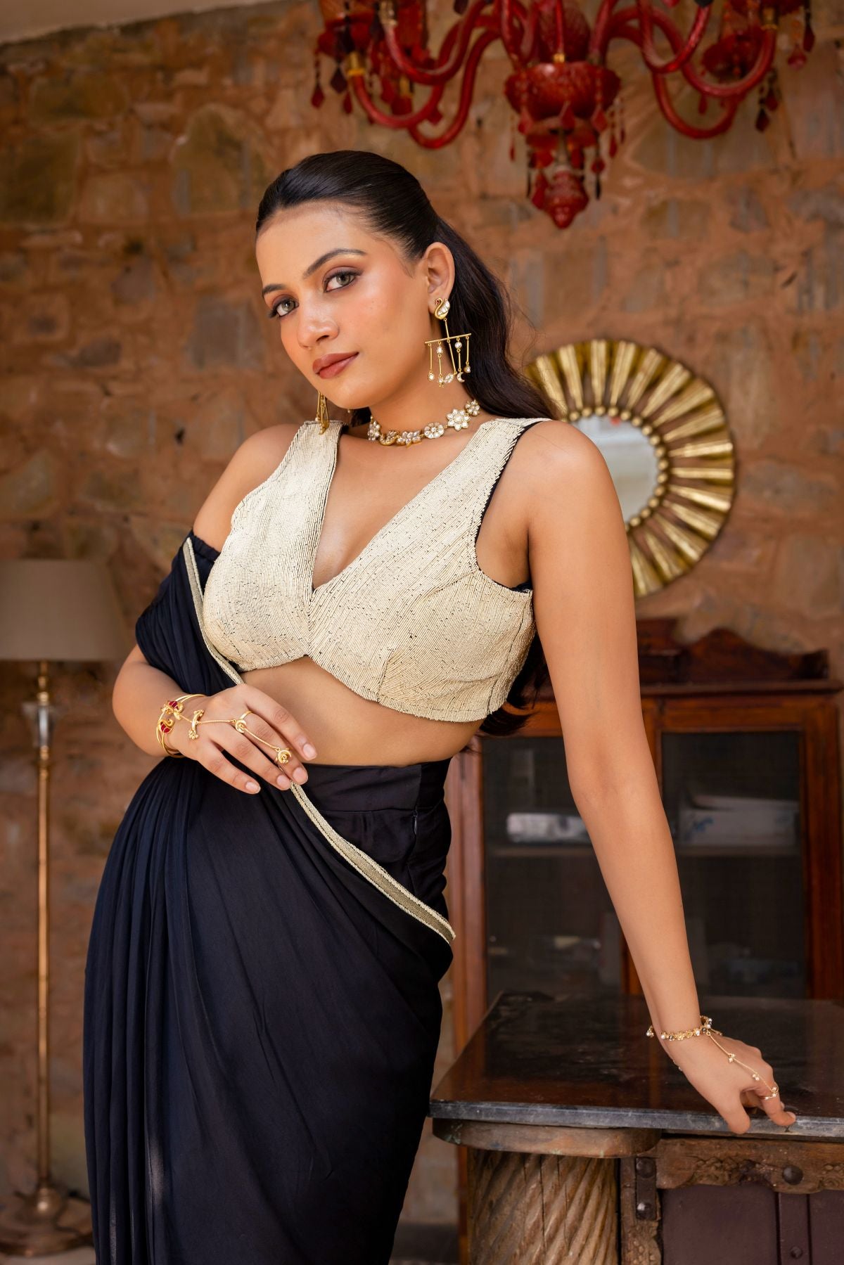 Black draped saree paired with a blouse