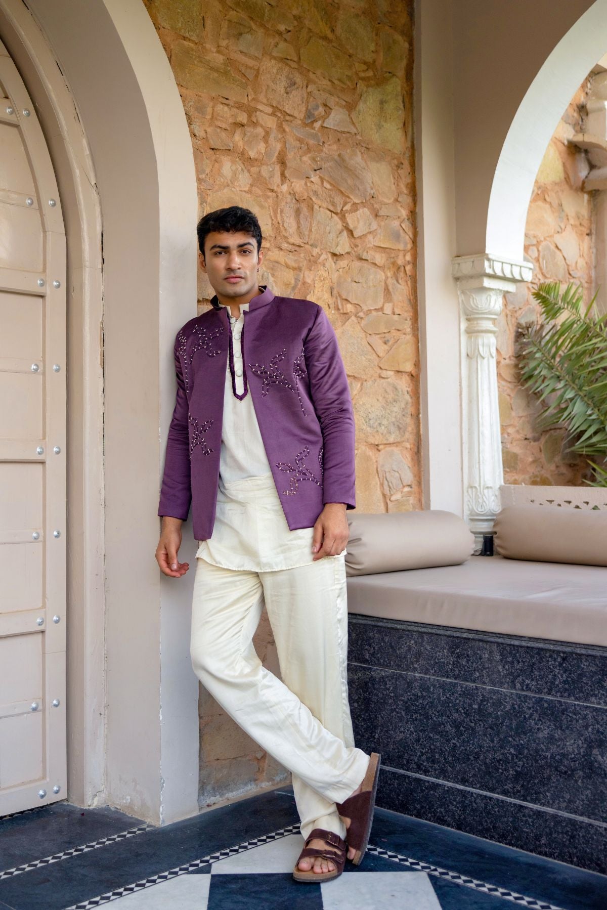 Off-white kurta set paired with embellished jacket