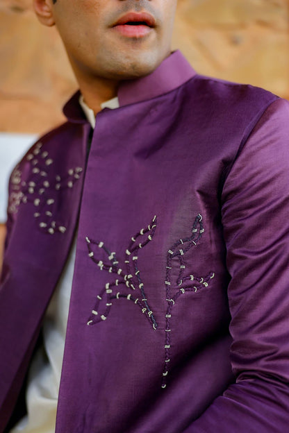 Off-white kurta set paired with embellished jacket