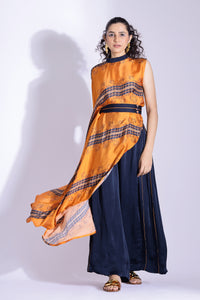 Asymmetric top paired with pleated pants - Studio Surbhi